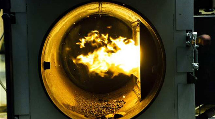 a picture of biomass pellet burning in a combustor